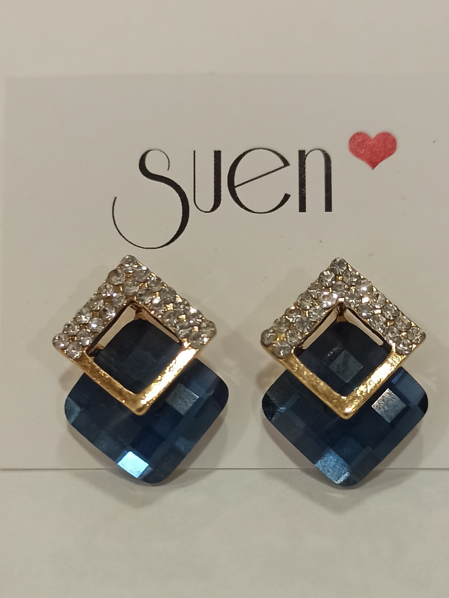 Pendientes de fiesta dorados con cristal azul y marquesitas