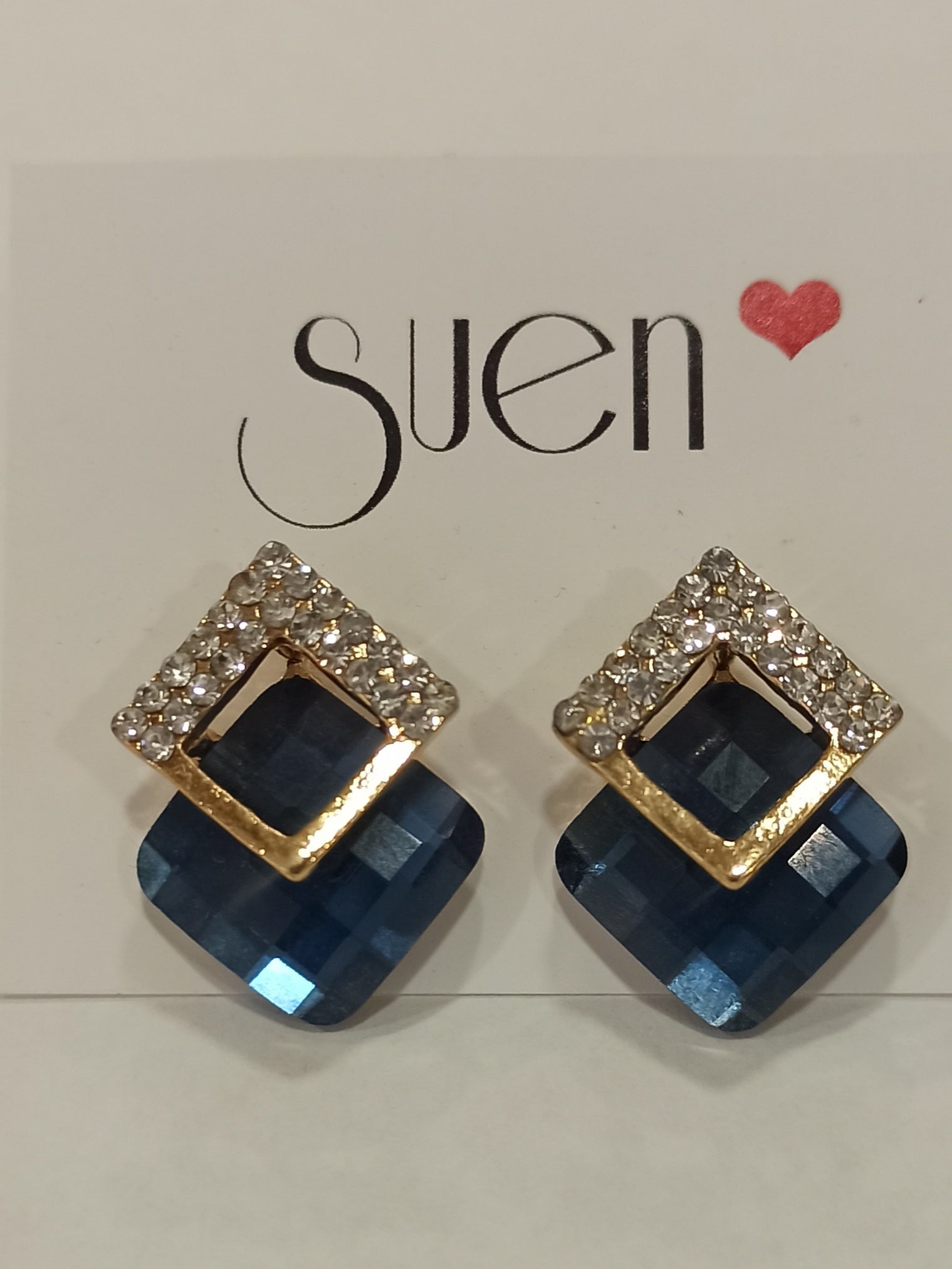 Pendientes de fiesta dorados con cristal azul y marquesitas