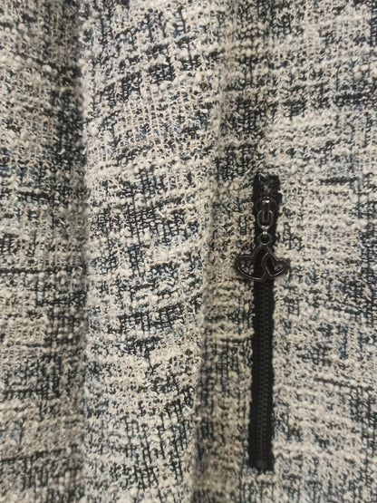 Fotografía real de la chaqueta jaspeada con cremallera