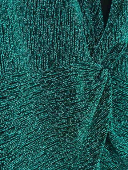 Detalle real del tejido verde de lurex elástico