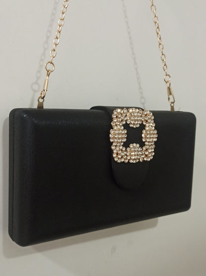 Bolso de fiesta negro con hebilla de brillantes