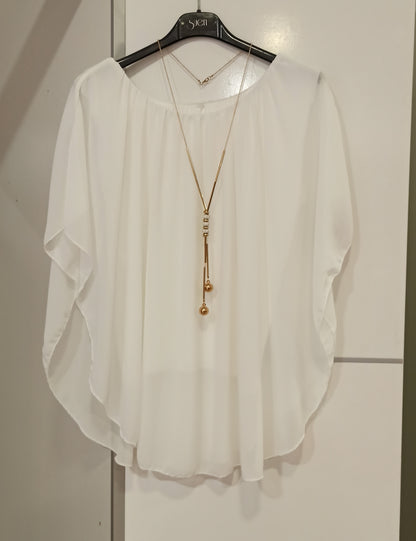 blusa de fiesta blanca con collar para invitadas-vista en percha