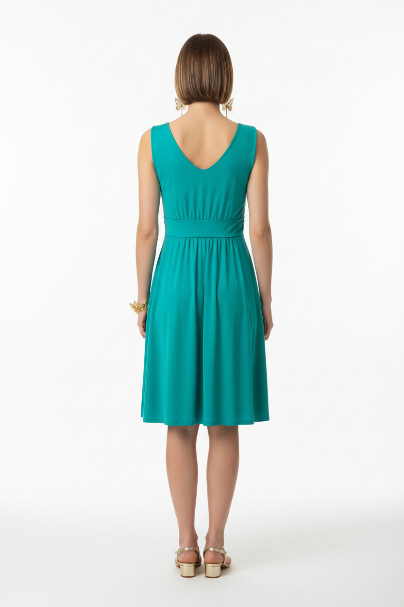 espalda vestido de fiesta corto invitada  color turquesa con escote pico cruzado