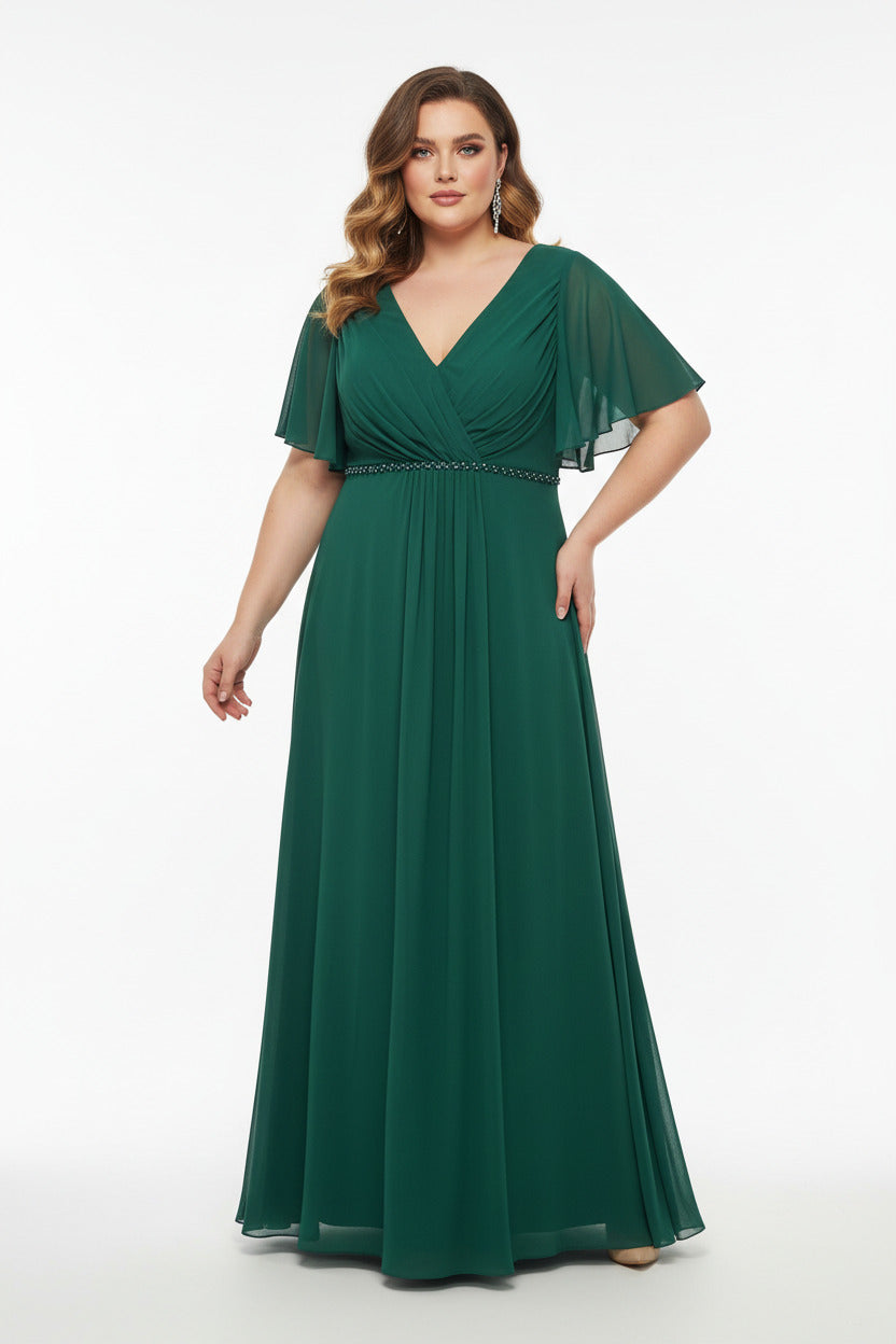 Vestido invitada boda favorecedor color verde con escote pico y manga corta detalle de pedreria